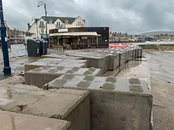 Click to view image Sea defence blocks pushed back by Storm Ciaran