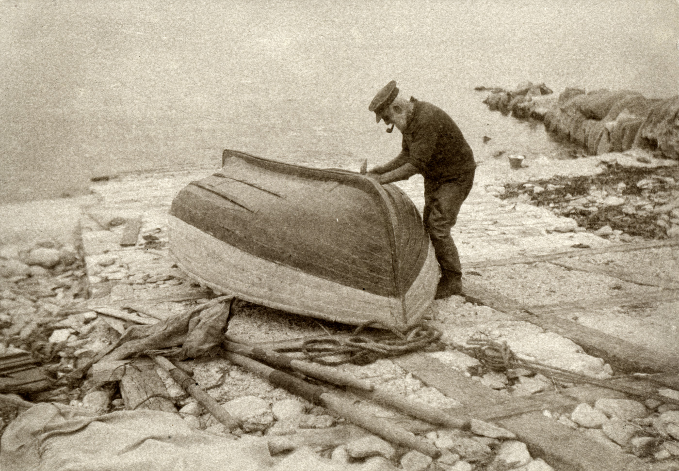 Fisherman repairing his boat in 1928