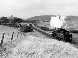 Click to view image Steam Engine 76005 heading to Corfe Castle in 1957