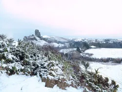Click to view image Corfe Castle in the Snow on the Purbeck Hills