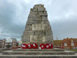 Click to view image Poppies resting on the Swanage War Memorial