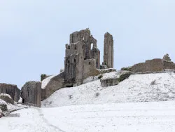 Click to view image Looking Up at Corfe Castle in the snow