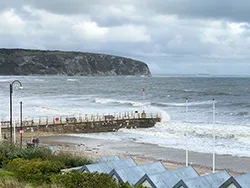 Click to view image Waves breaking over the Jetty